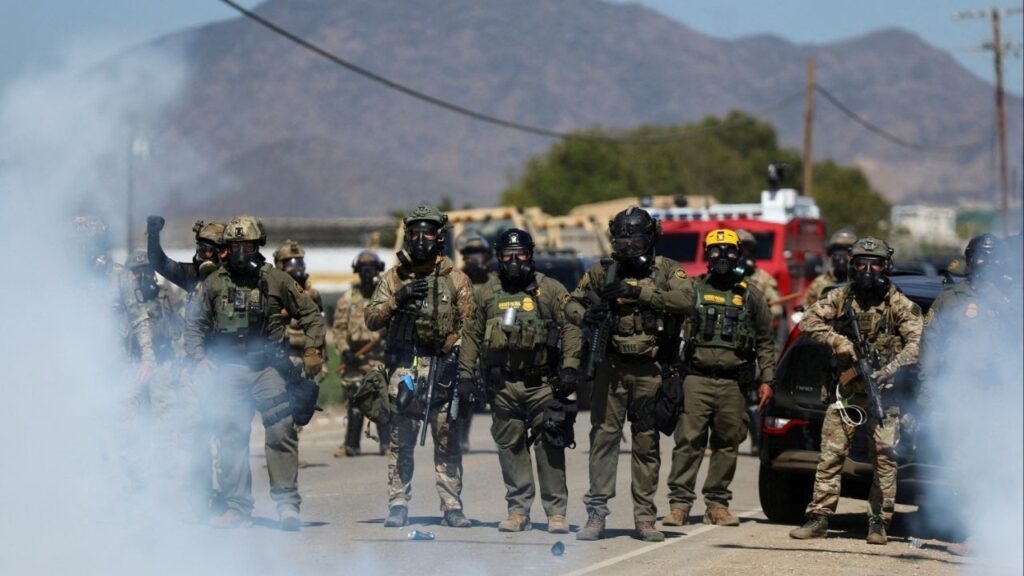 U.S. federal agents block a road leading to an agricultural facility where U.S. federal agents and immigration officers conducted an operation as tear gas is used to disperse protesters, in Camarillo, California, U.S., July 10, 2025. (Reuters File)