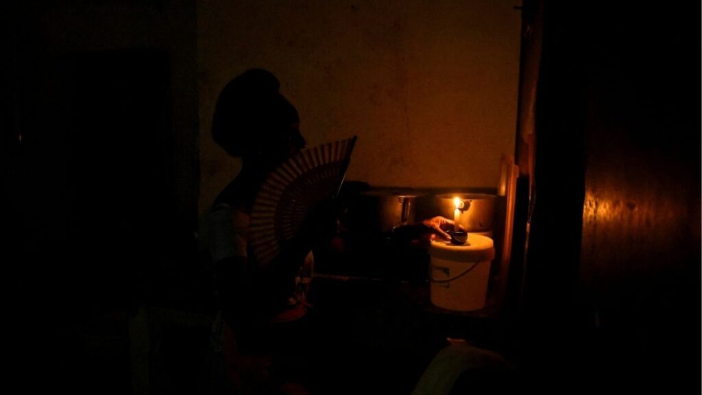 Veronica Hernandez prepares a candle in her home during a national power grid collapse, the fourth in less than a year, which caused a nationwide blackout, in Havana, Cuba September 10, 2025. (Reuters/Norlys Perez)