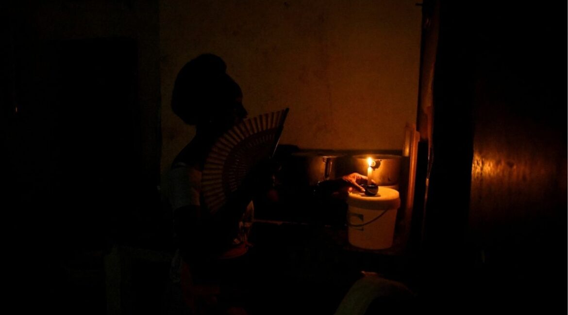 Veronica Hernandez prepares a candle in her home during a national power grid collapse, the fourth in less than a year, which caused a nationwide blackout, in Havana, Cuba September 10, 2025. (Reuters/Norlys Perez)