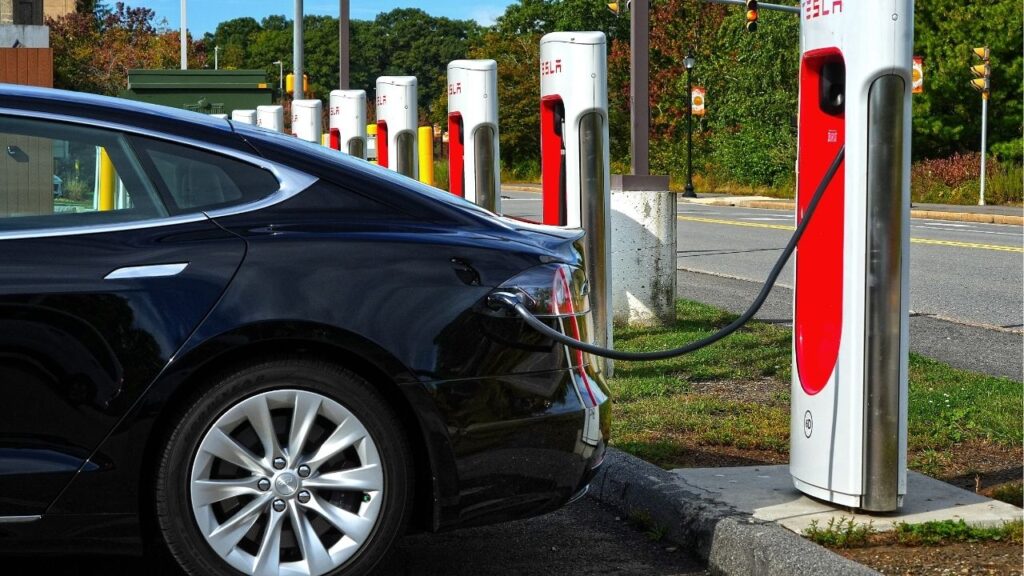 A Tesla charges at the EV charging station at the Auburn Mall. (USA Today Network via Reuters)