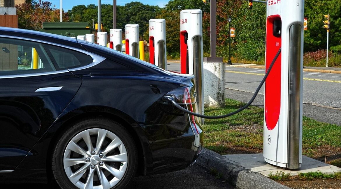 A Tesla charges at the EV charging station at the Auburn Mall. (USA Today Network via Reuters)