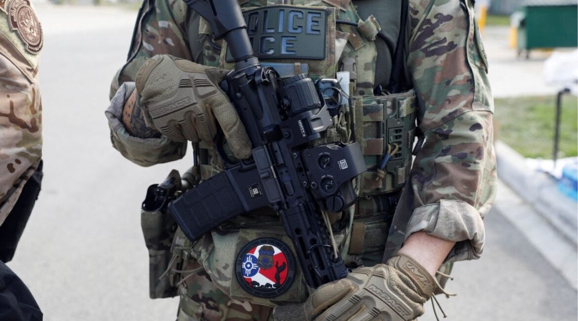 A U.S. Immigration and Customs Enforcement officer holds a weapon during a protest outside an ICE facility in Broadview, Illinois, U.S., September 12, 2025. (Reuters File)