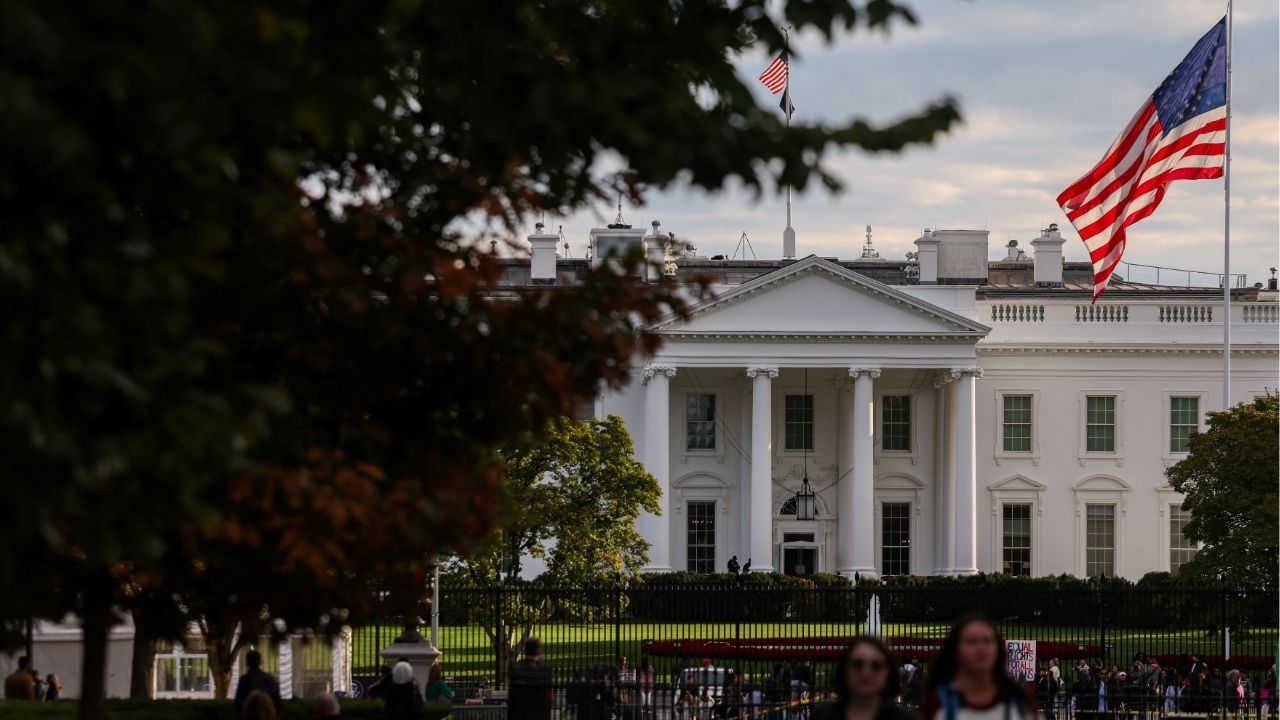 A U.S. flag flies in front of the White House as people walk by, weeks into the continuing U.S. government shutdown, in Washington, D.C., U.S., October 24, 2025. (Reuters File)