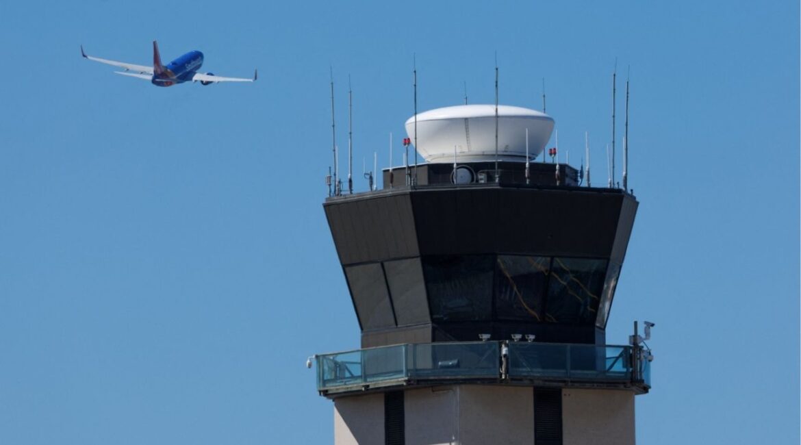 A commercial airliner takes off past the air traffic control tower at San Diego International Airport during the first day of a partial U.S. government shutdown in San Diego, California, U.S., October 1, 2025. (Reuters/Mike Blake)