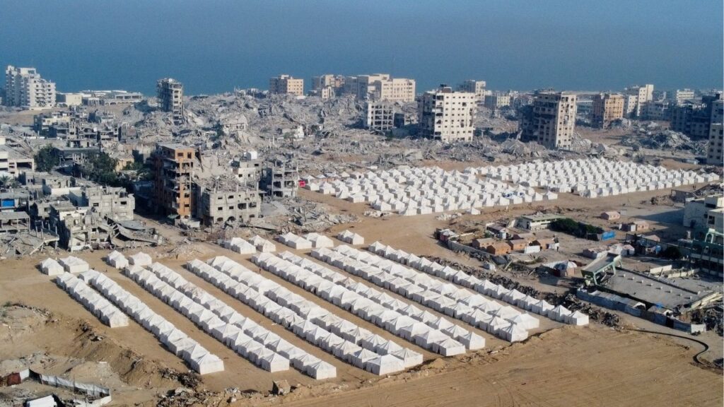 A drone view shows tents used by displaced Palestinians amid destroyed buildings, following the withdrawal of the Israeli forces from the area, amid a ceasefire between Israel and Hamas in Gaza, in Gaza City, October 24, 2025. (Reuters/Dawoud Abu Alkas)