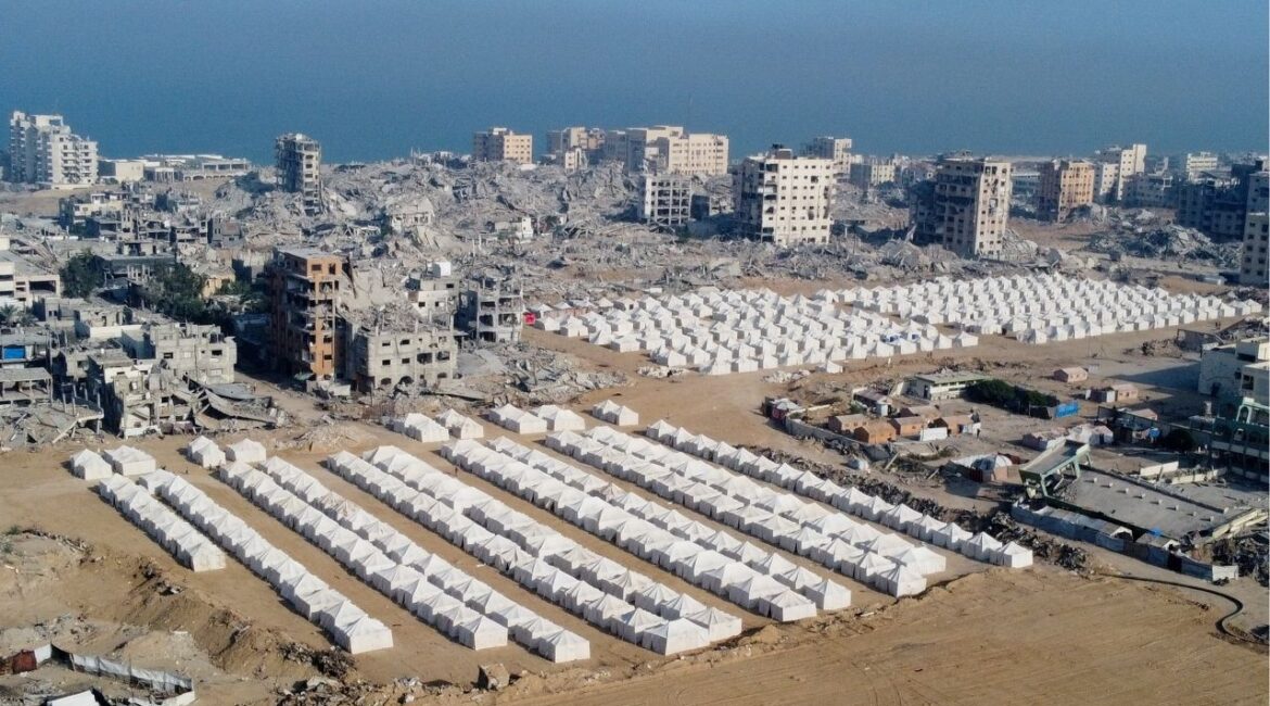 A drone view shows tents used by displaced Palestinians amid destroyed buildings, following the withdrawal of the Israeli forces from the area, amid a ceasefire between Israel and Hamas in Gaza, in Gaza City, October 24, 2025. (Reuters/Dawoud Abu Alkas)