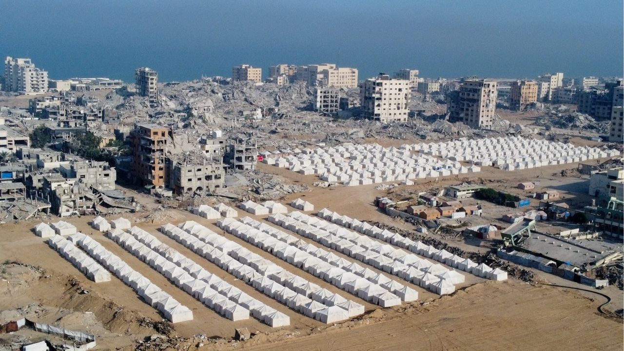 A drone view shows tents used by displaced Palestinians amid destroyed buildings, following the withdrawal of the Israeli forces from the area, amid a ceasefire between Israel and Hamas in Gaza, in Gaza City, October 24, 2025. (Reuters/Dawoud Abu Alkas)