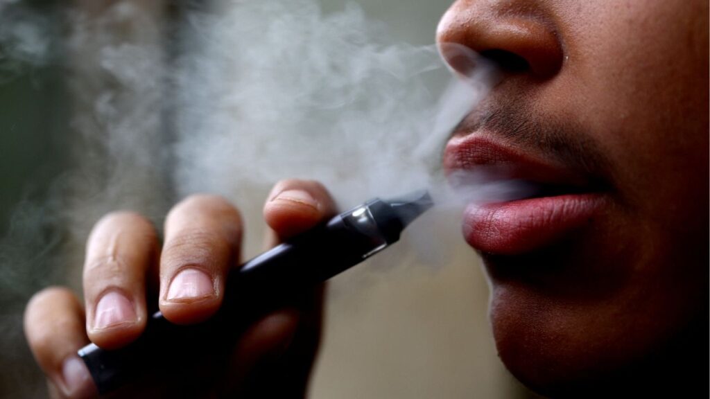 A man smokes a disposable vape, Newcastle-under-Lyme, Britain, September 14, 2023. (Reuters/Carl Recine)