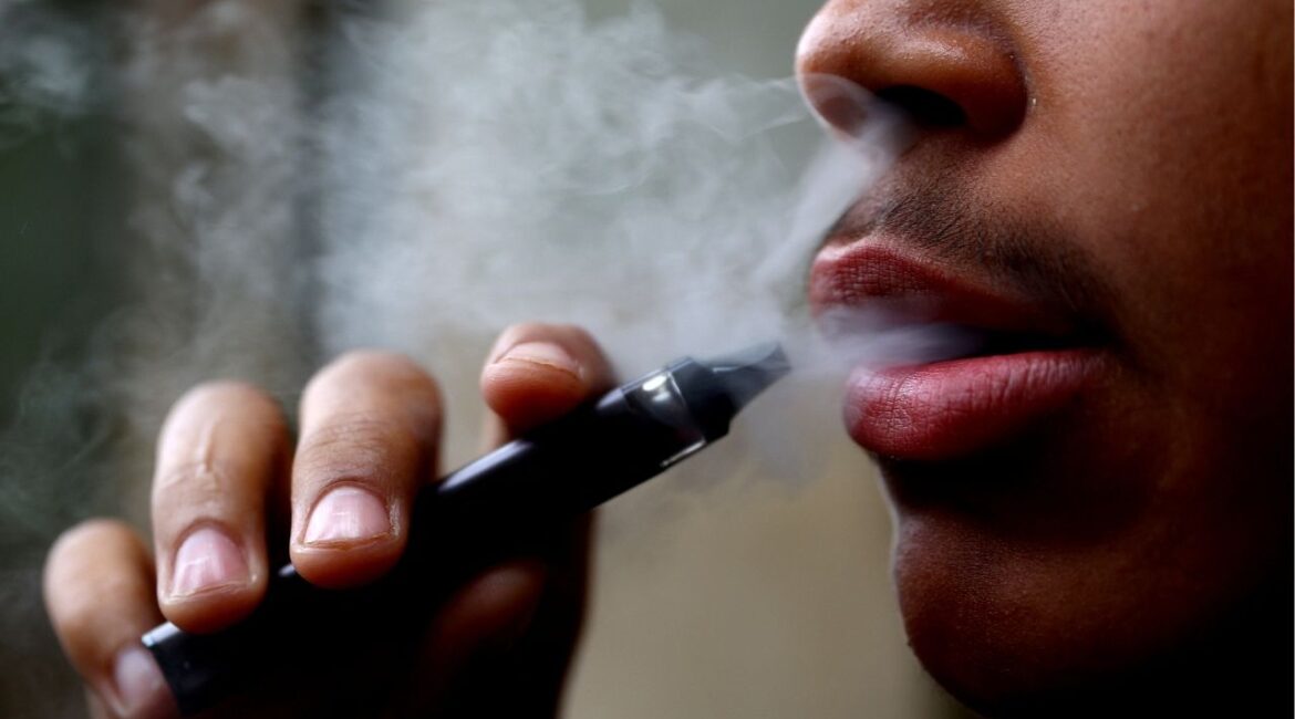 A man smokes a disposable vape, Newcastle-under-Lyme, Britain, September 14, 2023. (Reuters/Carl Recine)