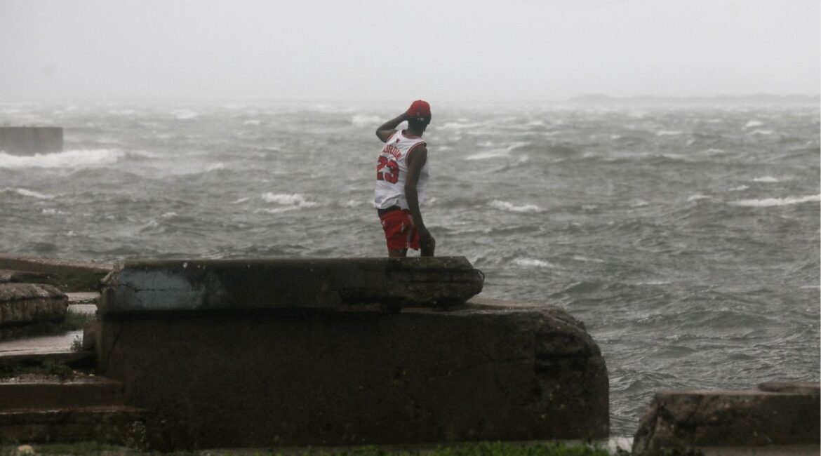 A man watches the waves, as Hurricane Melissa approaches, in Kingston, Jamaica, October 28, 2025. (Reuters/Octavio Jones)