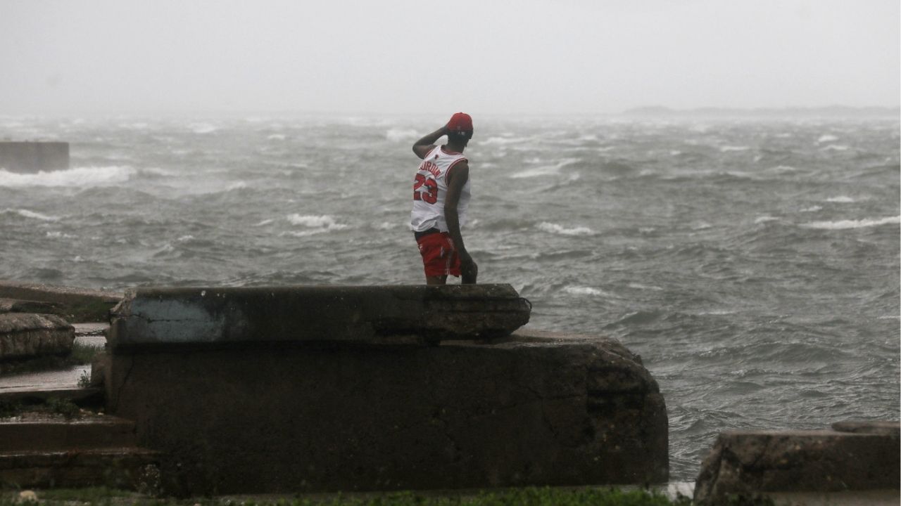 A man watches the waves, as Hurricane Melissa approaches, in Kingston, Jamaica, October 28, 2025. (Reuters/Octavio Jones)