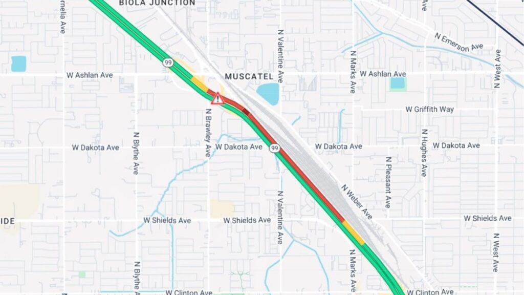 A refuse truck overturned Wednesday, Oct. 22, 2025, closing the northbound SR-99 offramp and No. 3 lane at Ashlan Avenue, with traffic backed up to Shields Avenue and no reopening time announced. (Caltrans)
