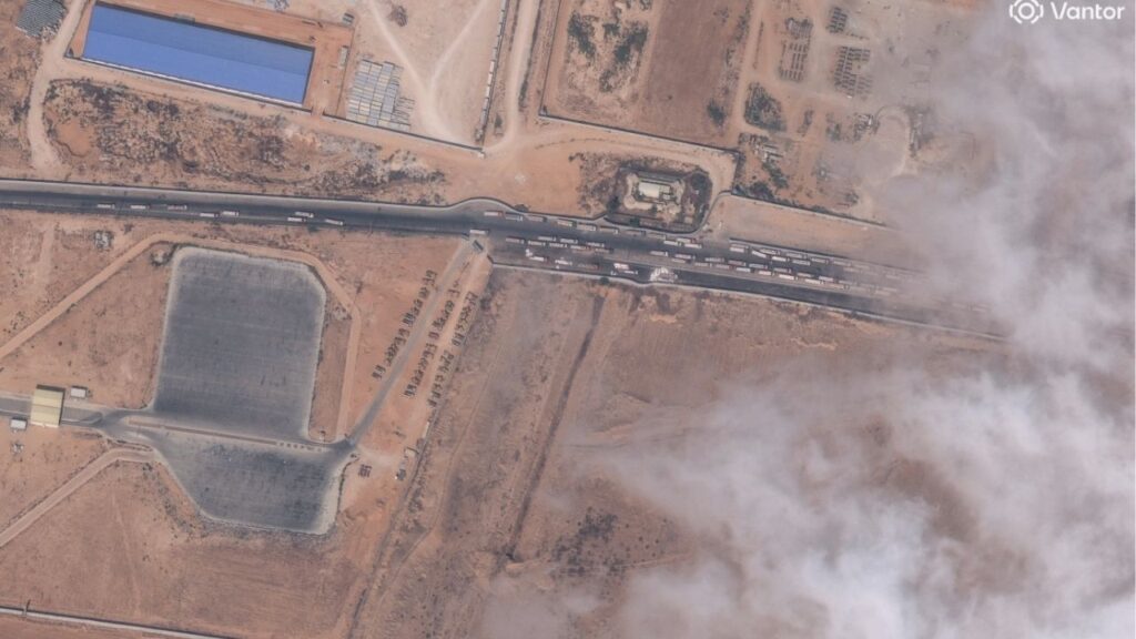 A satellite image shows trucks with aid waiting by the Egypt-Gaza border, October 15, 2025. Satellite image ©2025 Vantor/Handout via REUTERS