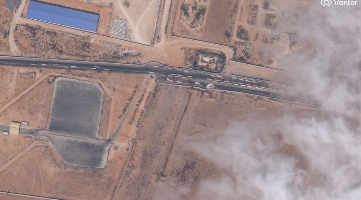 A satellite image shows trucks with aid waiting by the Egypt-Gaza border, October 15, 2025. Satellite image ©2025 Vantor/Handout via REUTERS