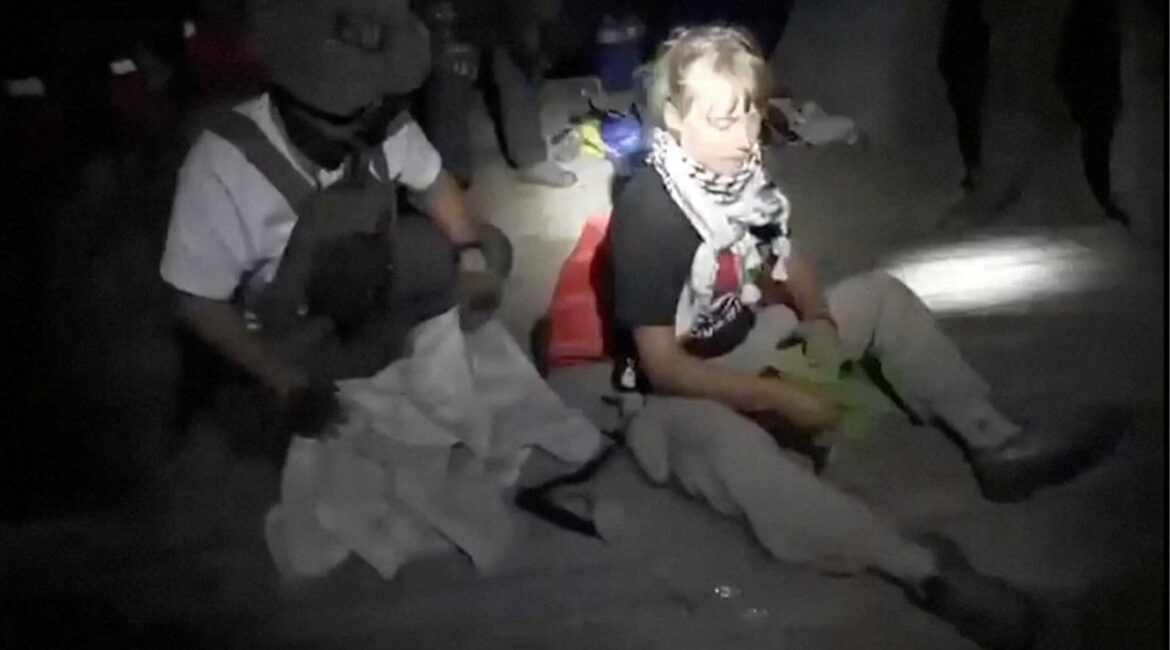 A screengrab from a video shows Swedish activist Greta Thunberg sitting next to a person wearing tactical gear, as vessels of the Global Sumud Flotilla are being intercepted by Israeli security forces, October 1, 2025. Israel Foreign Ministry/Handout via REUTERS