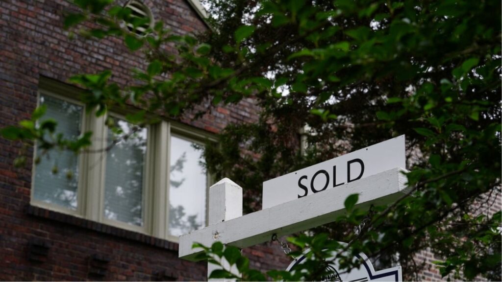 A "sold" sign is seen outside a home in Washington, U.S., July 7, 2022. (Reuters/Sarah Silbiger)