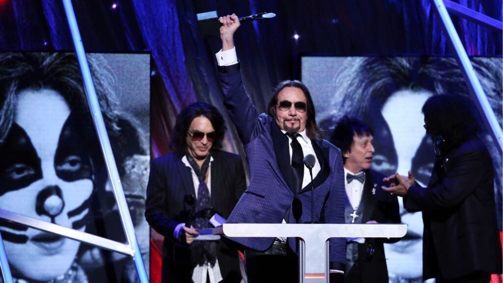 Ace Frehley, center, accepts an award with his Kiss bandmates during the 29th annual Rock & Roll Hall of Fame Induction Ceremony in New York, April 10, 2014. Frehley, the original lead guitarist of the band Kiss, who often performed in white-and-silver face makeup and sold millions of records during his two tenures with the band — from 1973 to 1982, and then from 1996 to 2002 — died on Thursday, Oct. 16, 2025, in Morristown, N.J. He was 74. (Richard Perry/The New York Times)