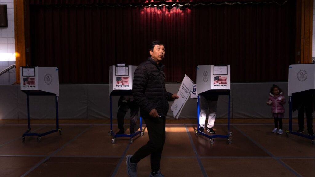 An early voter at a polling place set up in a church on Staten Island, where a Republican congresswoman represents the 11th Congressional District, on Sunday, Oct. 26, 2025. A suit filed by an election law firm contends that the state’s 11th Congressional District is drawn in a way that disenfranchises Black and Latino voters. (Adam Gray/The New York Times)