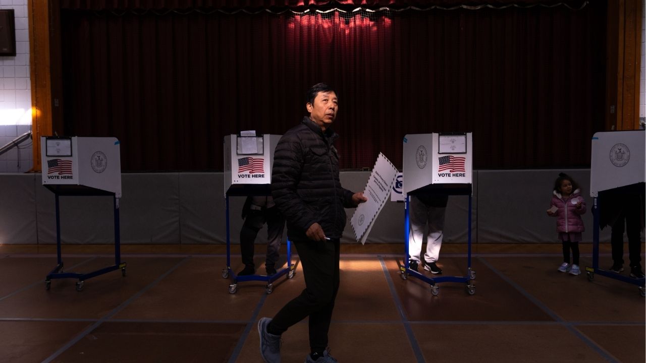 An early voter at a polling place set up in a church on Staten Island, where a Republican congresswoman represents the 11th Congressional District, on Sunday, Oct. 26, 2025. A suit filed by an election law firm contends that the state’s 11th Congressional District is drawn in a way that disenfranchises Black and Latino voters. (Adam Gray/The New York Times)