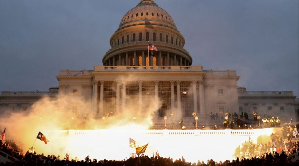 An explosion caused by a police munition is seen while supporters of U.S. President Donald Trump riot in front of the U.S. Capitol Building in Washington, U.S., January 6, 2021. (Reuters File)