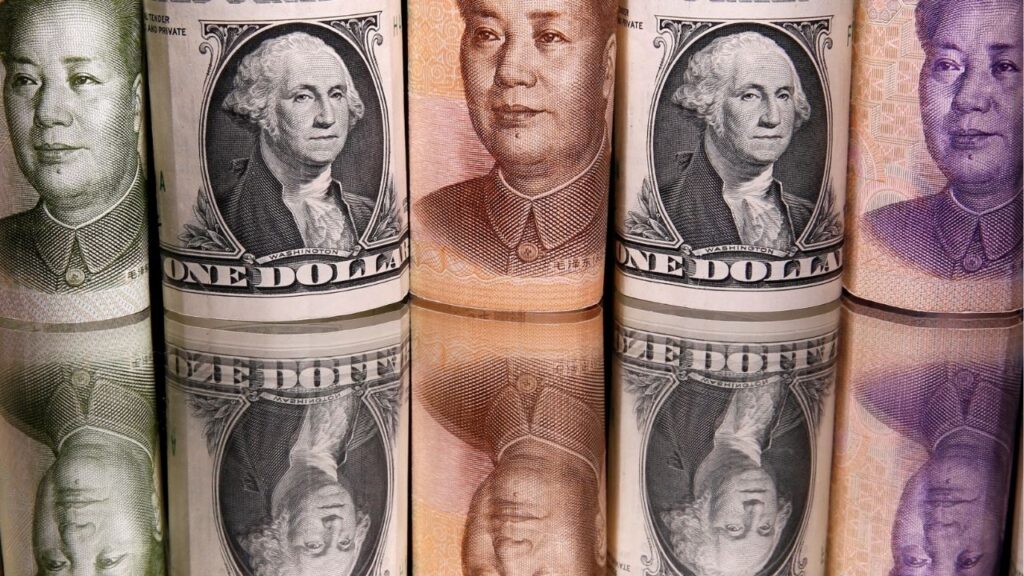 Chinese Yuan and U.S. dollar banknotes are seen in this illustration taken February 10, 2020. (Reuters/Dado Ruvic/Illustration)