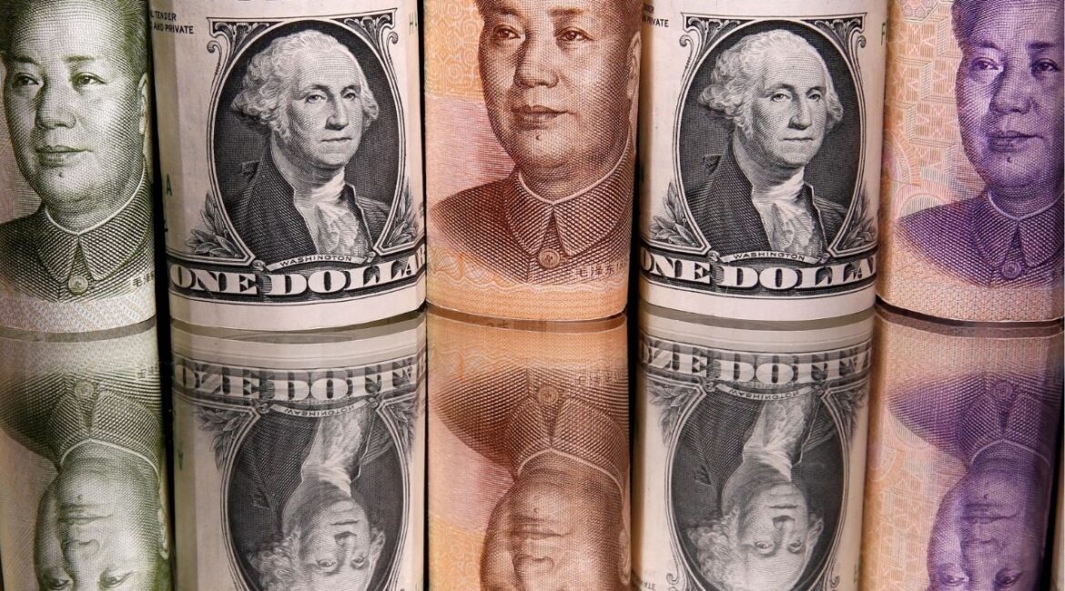 Chinese Yuan and U.S. dollar banknotes are seen in this illustration taken February 10, 2020. (Reuters/Dado Ruvic/Illustration)