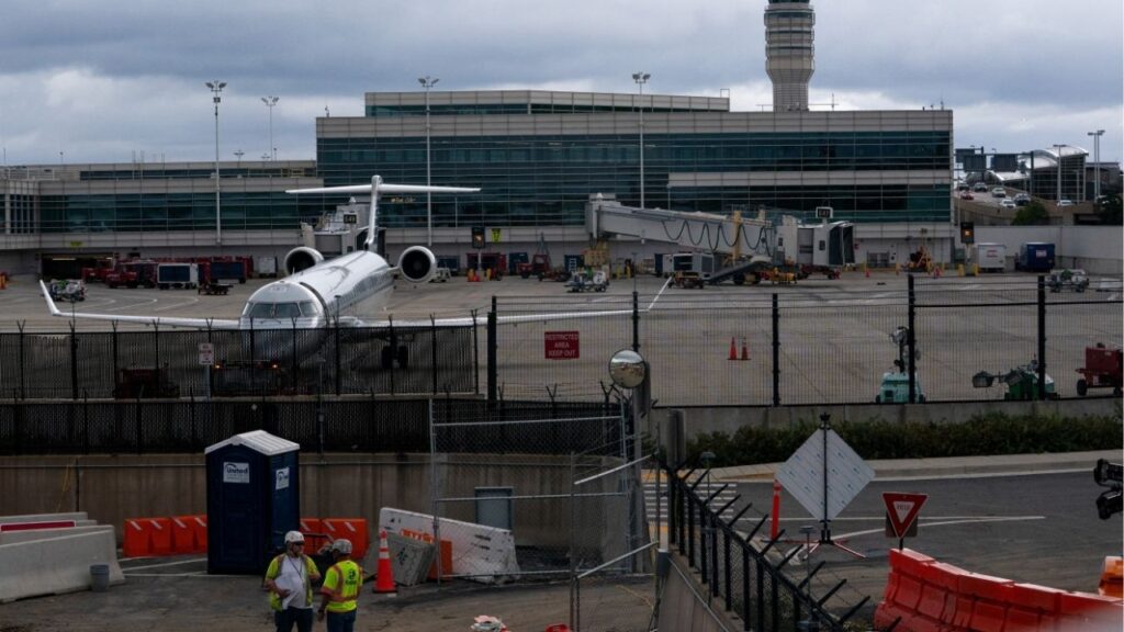 Construction crews work near the air traffic control tower at Reagan Washington National Airport as the U.S. government shutdown continues in Arlington, Virginia, U.S., October 8, 2025. (Reuters/Nathan Howard)
