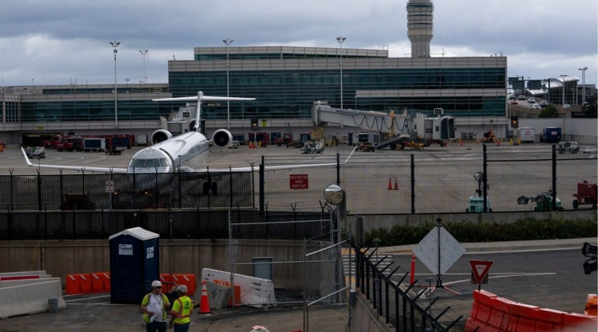Construction crews work near the air traffic control tower at Reagan Washington National Airport as the U.S. government shutdown continues in Arlington, Virginia, U.S., October 8, 2025. (Reuters/Nathan Howard)
