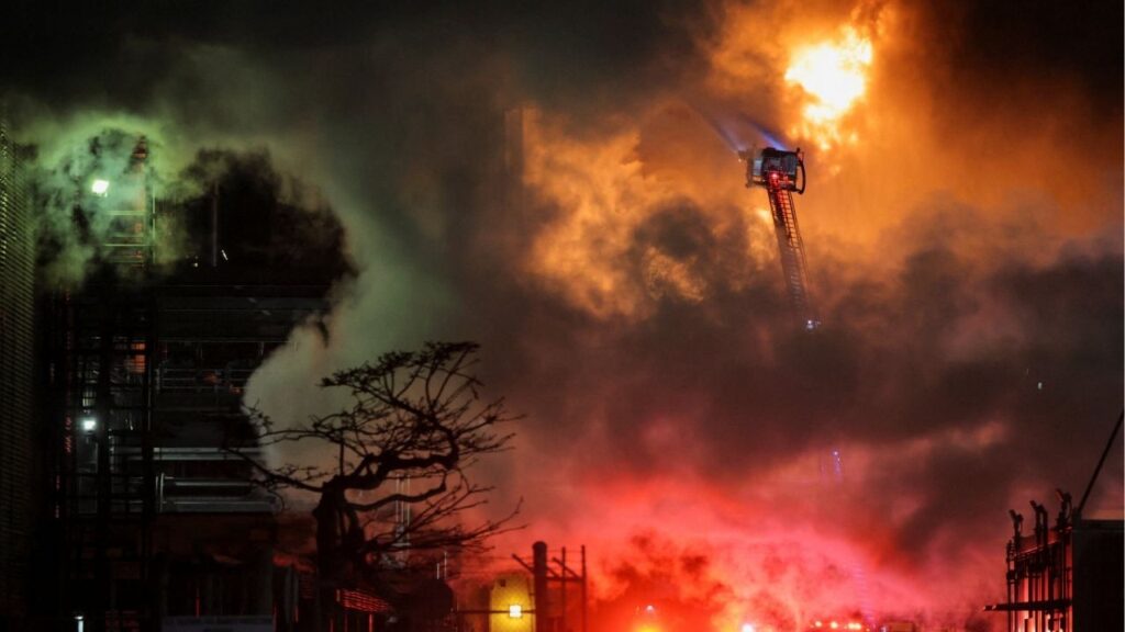 Firefighters work to contain a large fire that broke out at the Chevron refinery, in El Segundo, California, U.S., October 2, 2025. REUTERS/Daniel Cole