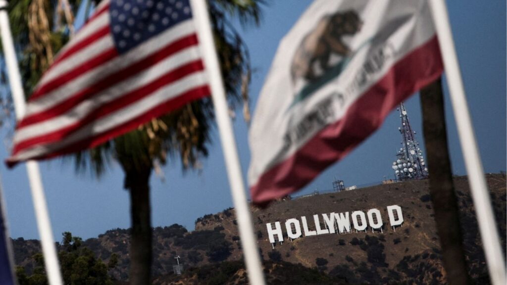Flags flutter in front of the Hollywood sign after U.S. President Donald Trump ordered a 100% tariff on foreign-made films in Los Angeles, California, U.S., September 29, 2025. (Reuters File)