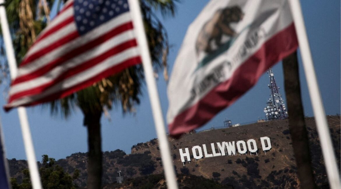 Flags flutter in front of the Hollywood sign after U.S. President Donald Trump ordered a 100% tariff on foreign-made films in Los Angeles, California, U.S., September 29, 2025. (Reuters File)