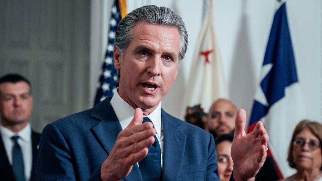 Gov. Gavin Newsom of California is accompanied by California and Texas lawmakers as he speaks in support of the Texas Democratic legislators for their walkout, at the Governor's Mansion in Sacramento, Calif., Aug. 8, 2025. Newsom vetoed bills that would have provided tangible benefits to descendants of slavery, though he approved a state reparations agency. (Andri Tambunan/The New York Times)