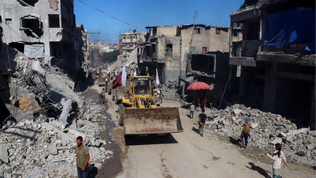Heavy machinery drives through a street, amid a ceasefire between Israel and Hamas, in Gaza City, October 14, 2025. (Reuters/Ebrahim Hajjaj)