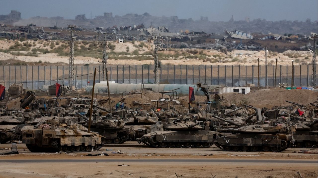 Israeli tanks sit, after U.S. President Donald Trump announced that Israel and Hamas agreed on the first phase of a Gaza ceasefire, on the Israeli side of the border with Gaza, October 9, 2025. (Reuters/Ammar Awad)