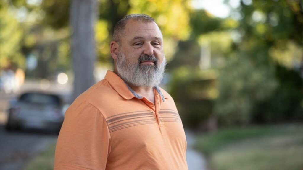 Kevin Bohnstedt stands in front of his home in central Fresno on Oct. 7, 2025. (CalMatters/CatchLight Local/Larry Valenzuela)