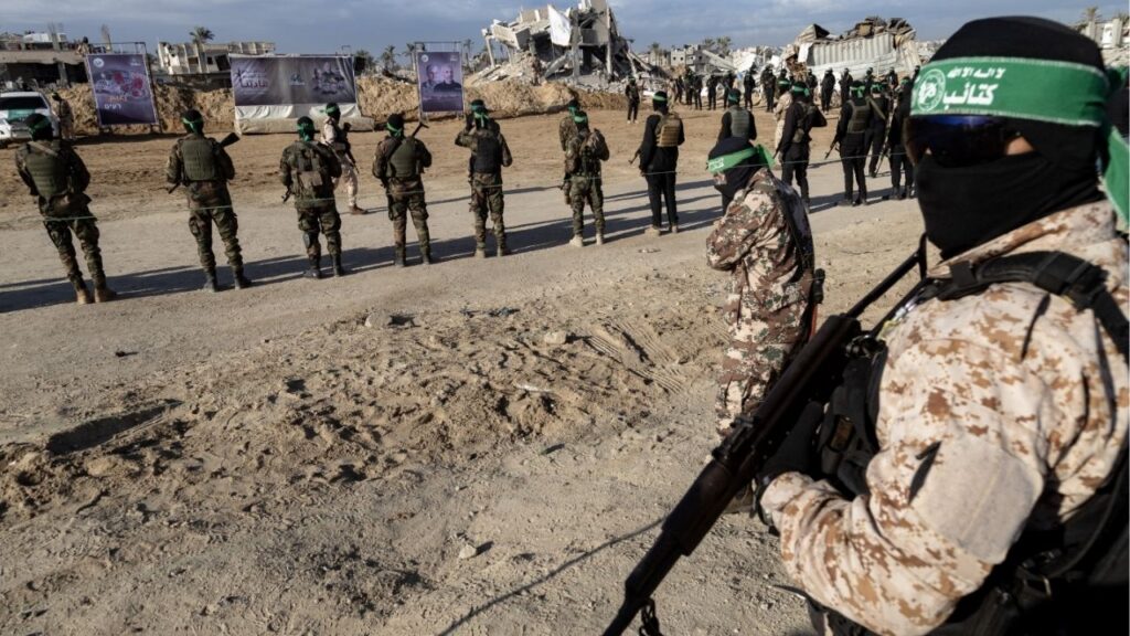 Members of Hamas gather during a hostage handover in Khan Younis in the Gaza Strip, Feb. 1, 2025. Some Arab mediators negotiating an end to the war in Gaza believe that they can convince Hamas to partially disarm, a step that has long been a red line for the militant group, according to three people familiar with the mediators’ thinking. (Saher Alghorra/The New York Times)