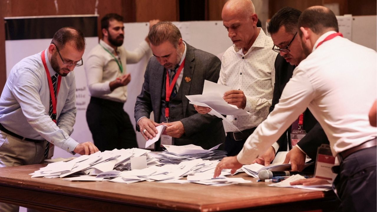 Members of electoral colleges count votes, on the day they vote for candidates of the new Syrian Parliament since Bashar al-Assad's government was toppled, in Aleppo, Syria, October 5, 2025. (Reuters/Mahmoud Hassano)