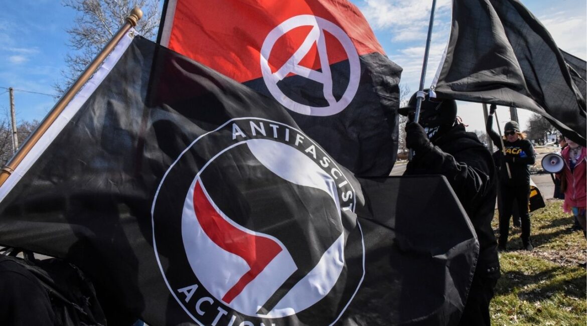 Members of the Great Lakes anti-fascist organization (Antifa) fly flags during a protest against the Alt-right outside a hotel in Warren, Michigan, U.S., March 4, 2018. (Reuters File)
