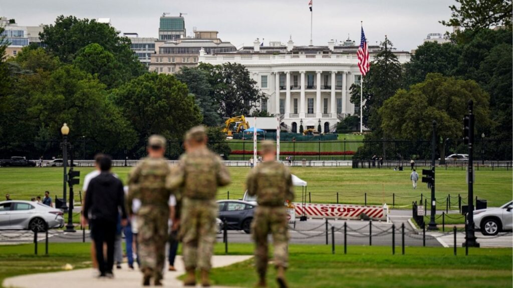 Members of the National Guard walk near the White House on the National Mall after U.S. President Donald Trump deployed the National Guard and ordered an increased presence of federal law enforcement to assist in crime prevention, in Washington, D.C., U.S., August 21, 2025. (Reuters/Al Drago)