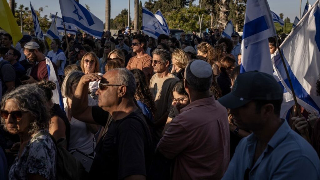 Mourners gather outside the cemetery ahead of the funeral for Guy Ilouz in Ra’anana, Israel, on Wednesday, Oct. 15, 2025. Ilouz was abducted in the Hamas-led Oct. 7, 2023, attack that ignited the Gaza war and his body was returned from the Gaza Strip this week. The Israeli military said that he succumbed to his wounds after not receiving proper medical care while held in Gaza. (Avishag Shaar-Yashuv/The New York Times)