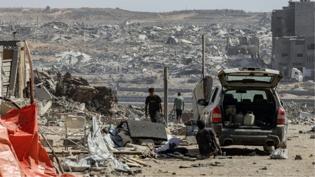 Palestinians return to an area near Gaza City to inspect their destroyed homes on Oct. 11, 2025, after the ceasefire was announced. Since an Israel-Hamas cease-fire deal came into effect, the U.S. effort to sustain it appears to have constrained Prime Minister Benjamin Netanyahu. (Saher Alghorra/The New York Times)