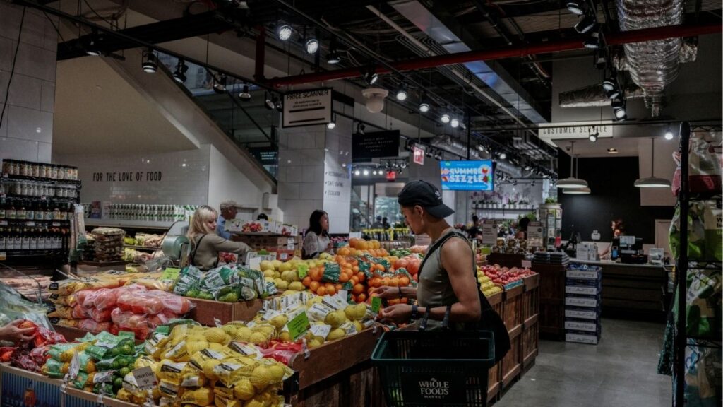 People shop for groceries at a store in New York City, U.S., July 15, 2025. (Reuters/Jeenah Moon)