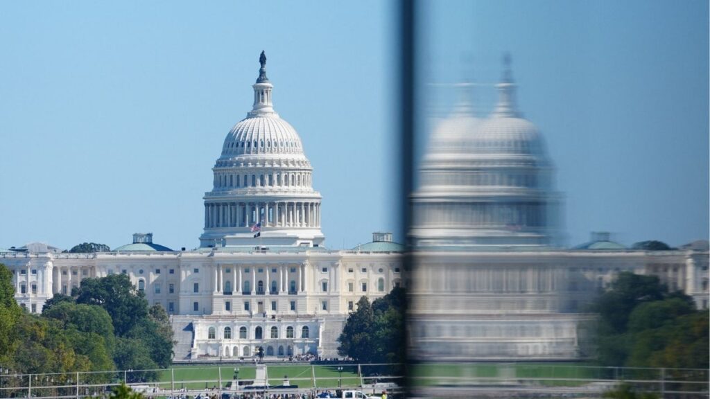 People walk near the U.S. Capitol Building during the fifth day of a partial government shutdown in Washington, D.C., U.S., October 5, 2025. (Reuters/Aaron Schwartz)