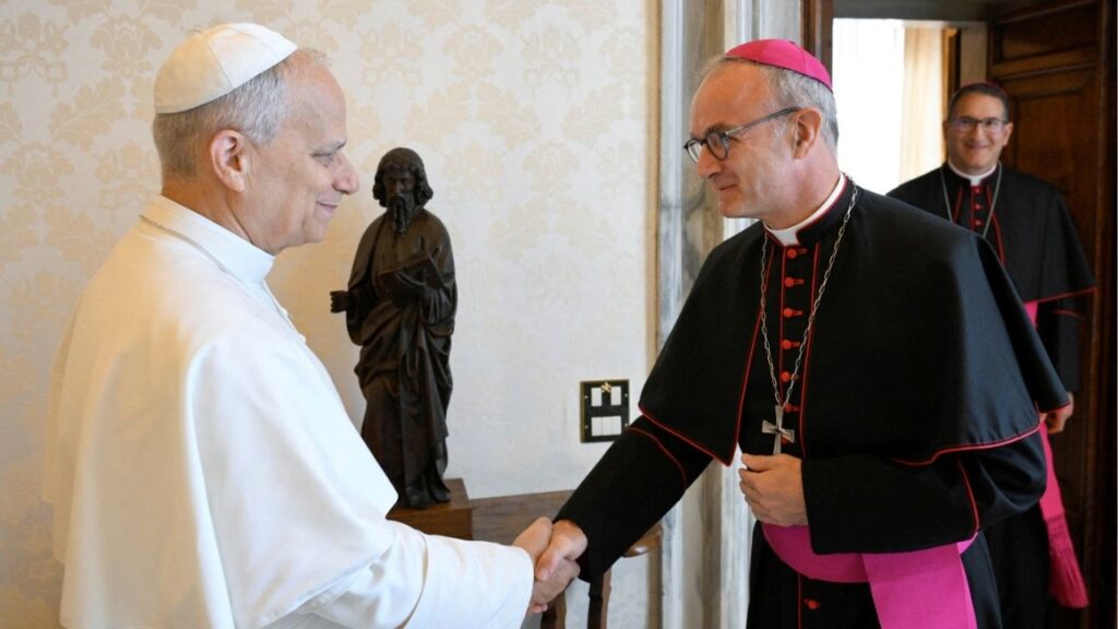 Pope Leo shakes hands with President of the Pontifical Commission for the Protection of Minors Archbishop Thibault Verny at the Vatican September 12, 2025. The Pontifical Commission for the Protection of Minors will issue its annual report on Thursday, October 16, 2025. Vatican Media/Simone Risoluti/Handout via REUTERS