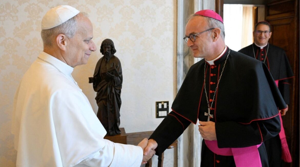 Pope Leo shakes hands with President of the Pontifical Commission for the Protection of Minors Archbishop Thibault Verny at the Vatican September 12, 2025. The Pontifical Commission for the Protection of Minors will issue its annual report on Thursday, October 16, 2025. Vatican Media/Simone Risoluti/Handout via REUTERS