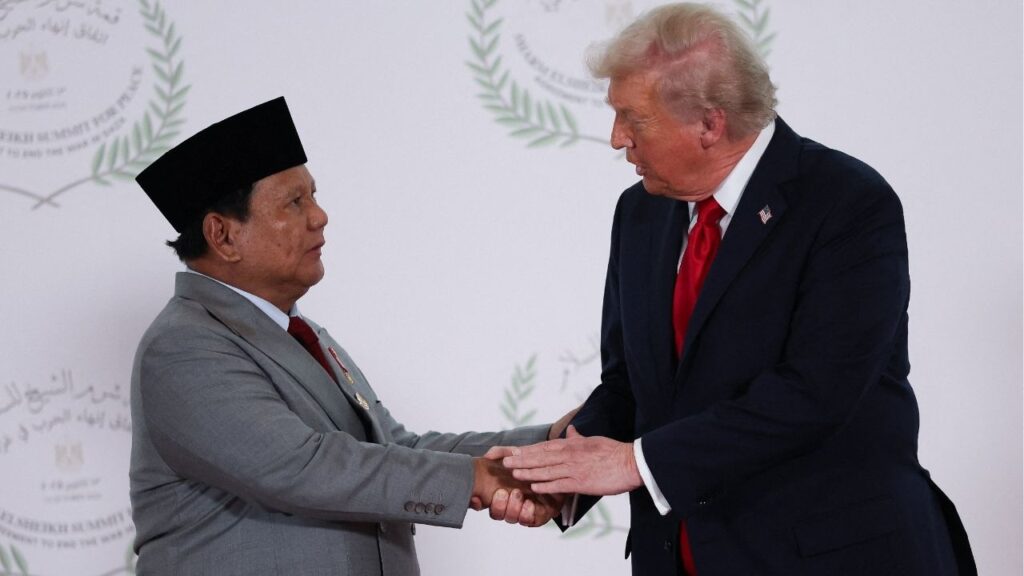 President Donald Trump and Indonesian President Prabowo Subianto shake hands as they pose for a photo, at a world leaders' summit on ending the Gaza war, amid a U.S.-brokered prisoner-hostage swap and ceasefire deal between Israel and Hamas, in Sharm el-Sheikh, Egypt, October 13, 2025. REUTERS/Suzanne Plunkett/Pool