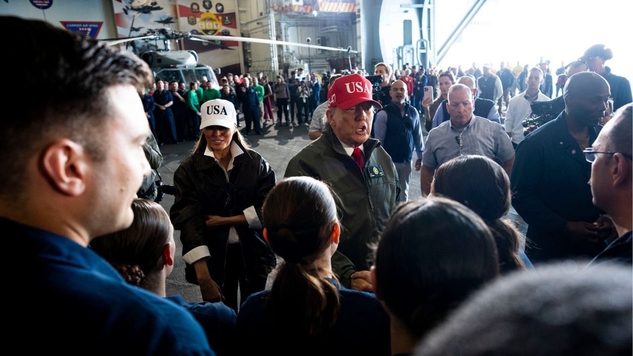 President Donald Trump and first lady Melania Trump greet troops aboard the USS George H.W. Bush off the coast of Norfolk, Va., on Sunday, Oct. 5, 2025. President Trump on Sunday called the deadly U.S. military strikes on boats in the Caribbean Sea “an act of kindness,” claiming that the attacks had halted drug trafficking via those waters into the United States. (Doug Mills/The New York Times)