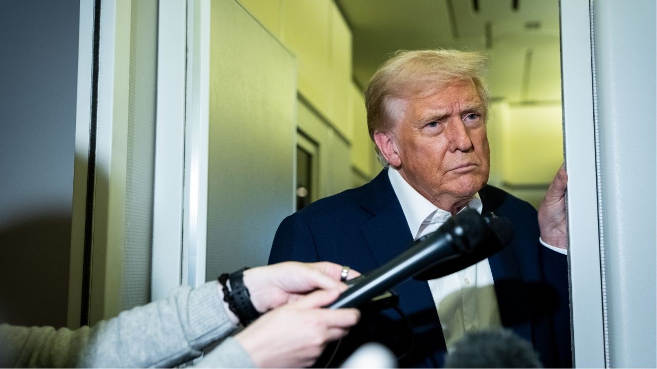 President Donald Trump speaks to reporters aboard Air Force One, late on Friday, Oct. 24, 2025. More than two dozen states sued the Trump administration on Tuesday over its recent refusal to fund food stamps during the government shutdown, seeking to spare roughly 42 million people from hunger and financial hardship starting in a matter of days. (Haiyun Jiang/The New York Times)