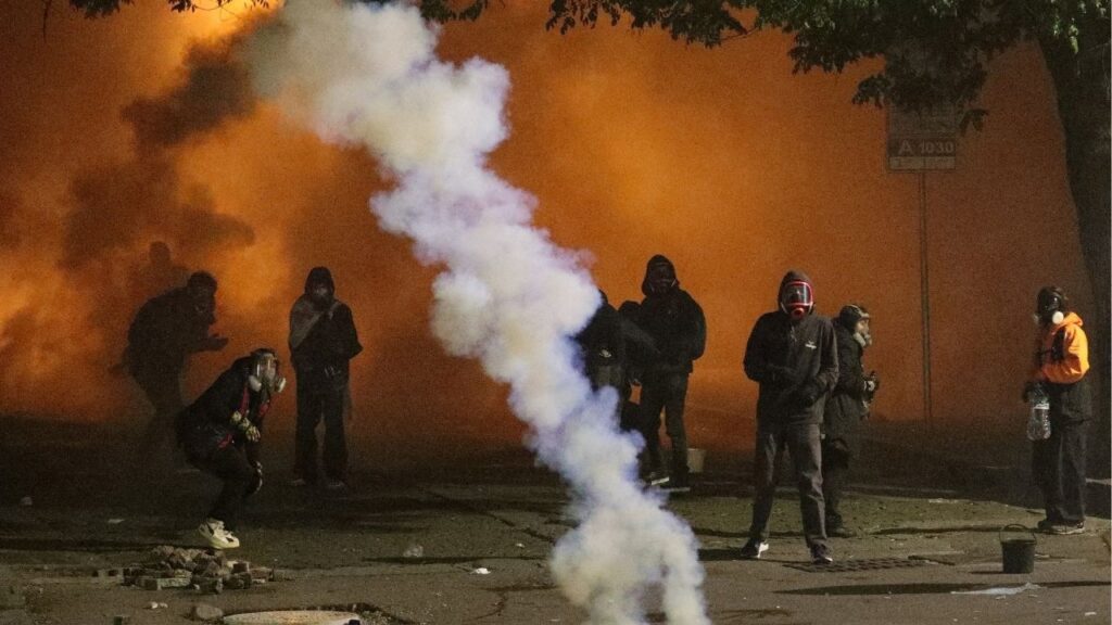 Protesters react to tear gas during an opposition rally on the day of local elections in Tbilisi, Georgia October 4, 2025. (Reuters/Irakli Gedenidze)