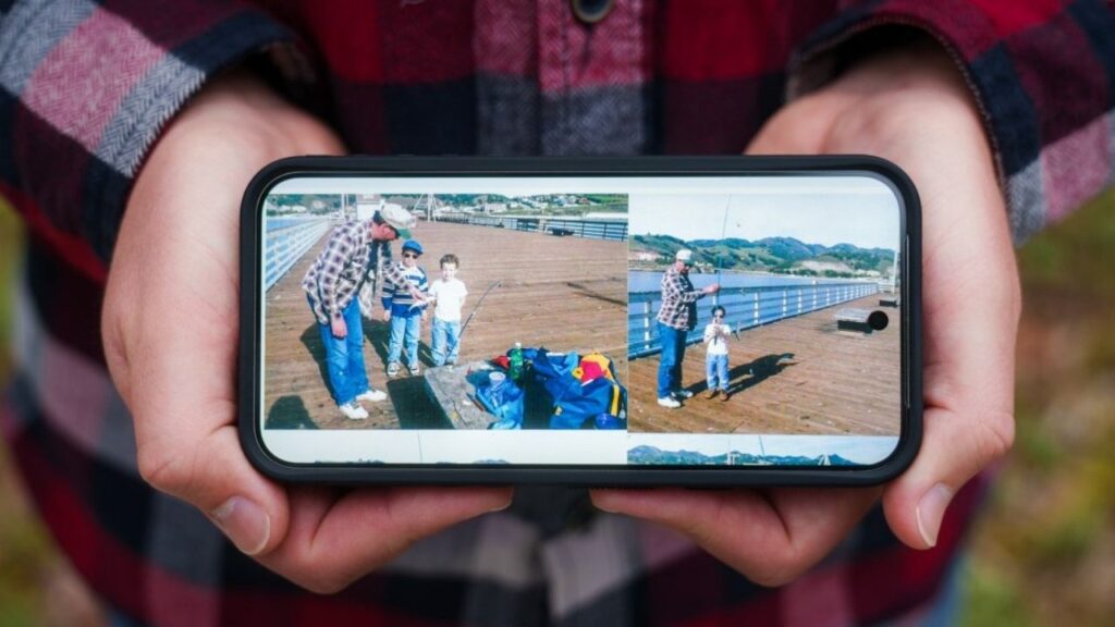 Ryan Nazaroff displays childhood photos on his phone. The photo on the left shows his father, Jeffrey Nazaroff, alongside Ryan and his younger brother, Thomas Nazaroff. The photo on the right shows his father with Thomas. Rowland Heights, Sept. 26, 2025. (CalMatters/Jules Hotz)